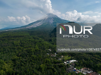 Mount Merapi volcano is spewing smoke as seen from Turgo village in the Sleman district of Yogyakarta, Indonesia, on December 25, 2023. Auth...