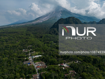 Mount Merapi volcano is spewing smoke as seen from Turgo village in the Sleman district of Yogyakarta, Indonesia, on December 25, 2023. Auth...