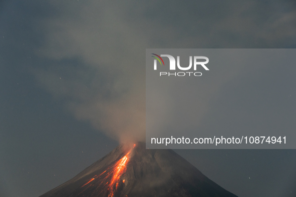 Mount Merapi volcano is spewing lava and smoke as seen from Tunggularum village in the Sleman district of Yogyakarta, Indonesia, on December...