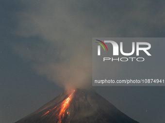 Mount Merapi volcano is spewing lava and smoke as seen from Tunggularum village in the Sleman district of Yogyakarta, Indonesia, on December...