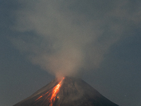 Mount Merapi volcano is spewing lava and smoke as seen from Tunggularum village in the Sleman district of Yogyakarta, Indonesia, on December...