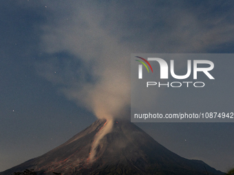 Mount Merapi volcano is spewing lava and smoke as seen from Tunggularum village in the Sleman district of Yogyakarta, Indonesia, on December...