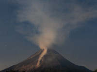 Mount Merapi volcano is spewing lava and smoke as seen from Tunggularum village in the Sleman district of Yogyakarta, Indonesia, on December...