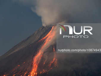 Mount Merapi volcano is spewing lava and smoke as seen from Tunggularum village in the Sleman district of Yogyakarta, Indonesia, on December...