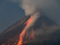 Mount Merapi volcano is spewing lava and smoke as seen from Tunggularum village in the Sleman district of Yogyakarta, Indonesia, on December...