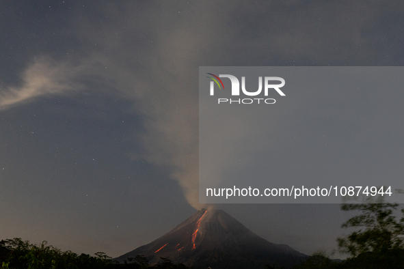 Mount Merapi volcano is spewing lava and smoke as seen from Tunggularum village in the Sleman district of Yogyakarta, Indonesia, on December...