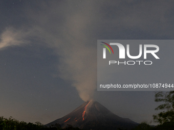 Mount Merapi volcano is spewing lava and smoke as seen from Tunggularum village in the Sleman district of Yogyakarta, Indonesia, on December...