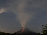 Mount Merapi volcano is spewing lava and smoke as seen from Tunggularum village in the Sleman district of Yogyakarta, Indonesia, on December...