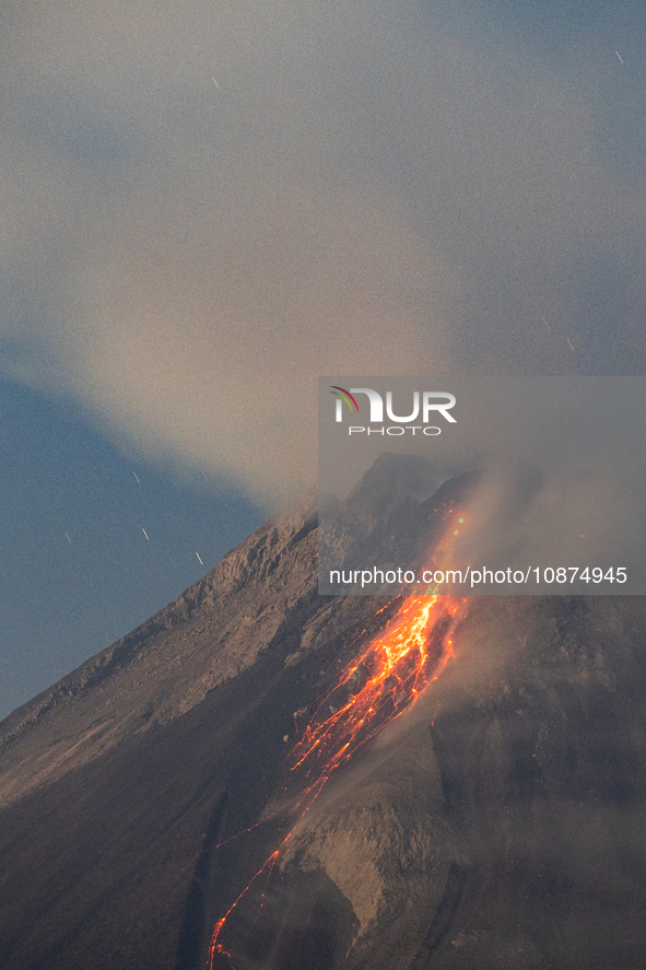 Mount Merapi volcano is spewing lava and smoke as seen from Tunggularum village in the Sleman district of Yogyakarta, Indonesia, on December...