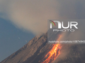 Mount Merapi volcano is spewing lava and smoke as seen from Tunggularum village in the Sleman district of Yogyakarta, Indonesia, on December...