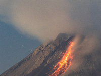 Mount Merapi volcano is spewing lava and smoke as seen from Tunggularum village in the Sleman district of Yogyakarta, Indonesia, on December...