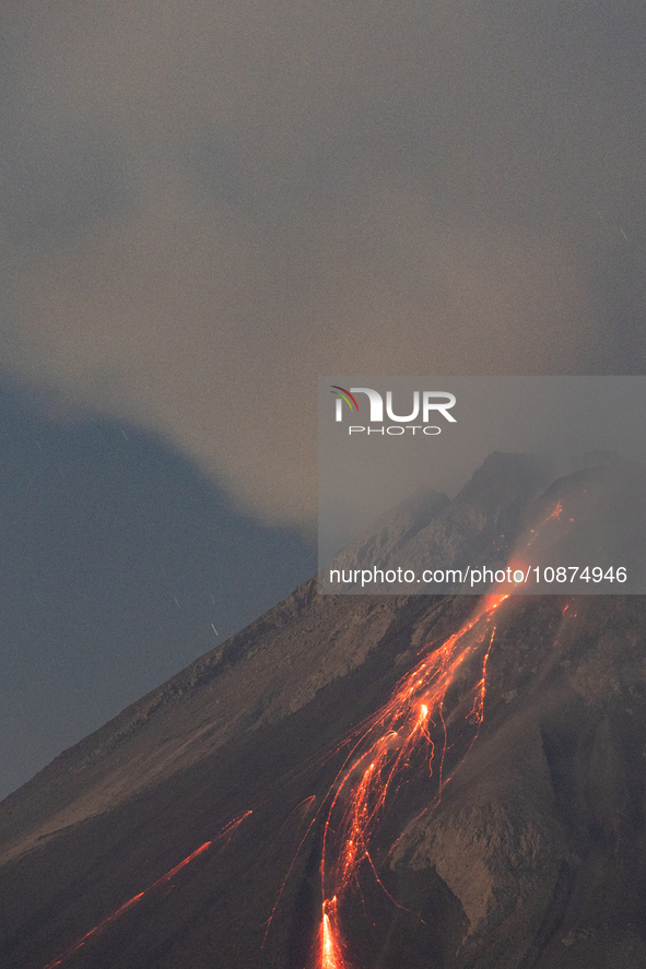 Mount Merapi volcano is spewing lava and smoke as seen from Tunggularum village in the Sleman district of Yogyakarta, Indonesia, on December...