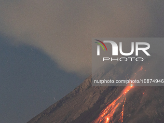 Mount Merapi volcano is spewing lava and smoke as seen from Tunggularum village in the Sleman district of Yogyakarta, Indonesia, on December...