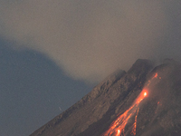 Mount Merapi volcano is spewing lava and smoke as seen from Tunggularum village in the Sleman district of Yogyakarta, Indonesia, on December...