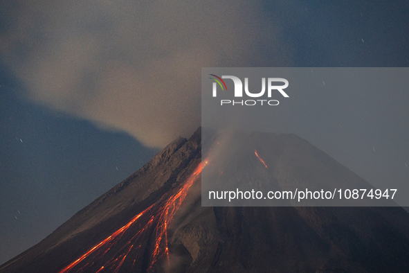 Mount Merapi volcano is spewing lava and smoke as seen from Tunggularum village in the Sleman district of Yogyakarta, Indonesia, on December...