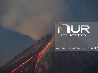 Mount Merapi volcano is spewing lava and smoke as seen from Tunggularum village in the Sleman district of Yogyakarta, Indonesia, on December...