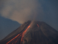 Mount Merapi volcano is spewing lava and smoke as seen from Tunggularum village in the Sleman district of Yogyakarta, Indonesia, on December...