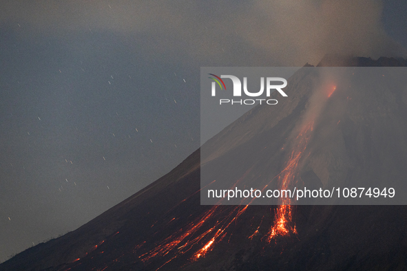 Mount Merapi volcano is spewing lava and smoke as seen from Tunggularum village in the Sleman district of Yogyakarta, Indonesia, on December...