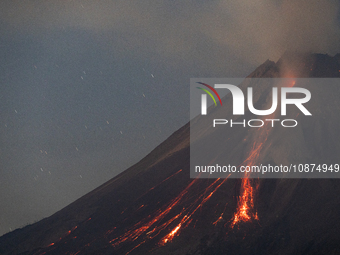 Mount Merapi volcano is spewing lava and smoke as seen from Tunggularum village in the Sleman district of Yogyakarta, Indonesia, on December...