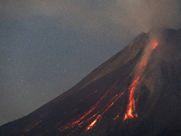 Mount Merapi volcano is spewing lava and smoke as seen from Tunggularum village in the Sleman district of Yogyakarta, Indonesia, on December...