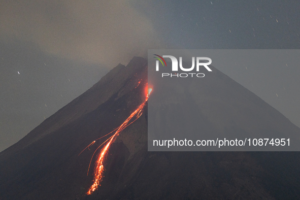 Mount Merapi volcano is spewing lava and smoke as seen from Tunggularum village in the Sleman district of Yogyakarta, Indonesia, on December...