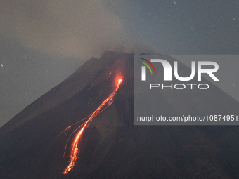 Mount Merapi volcano is spewing lava and smoke as seen from Tunggularum village in the Sleman district of Yogyakarta, Indonesia, on December...