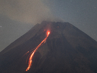 Mount Merapi volcano is spewing lava and smoke as seen from Tunggularum village in the Sleman district of Yogyakarta, Indonesia, on December...