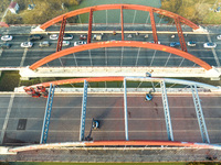 Construction workers are polishing, painting, and maintaining the Zhenxing Bridge in Donghai County, Lianyungang City, Jiangsu Province, Chi...