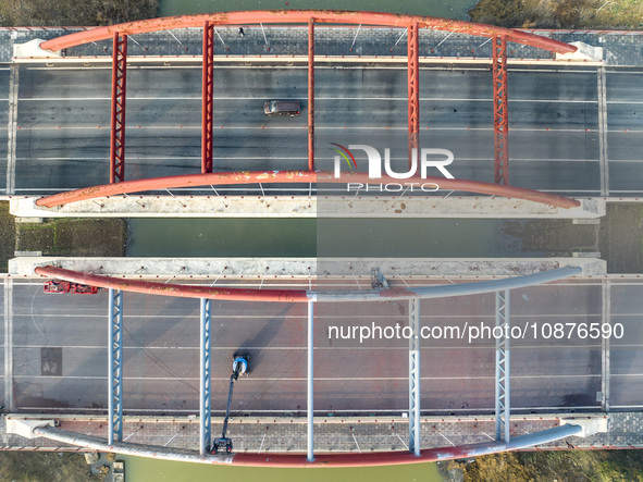 Construction workers are polishing, painting, and maintaining the Zhenxing Bridge in Donghai County, Lianyungang City, Jiangsu Province, Chi...