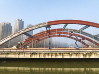 Construction workers are polishing, painting, and maintaining the Zhenxing Bridge in Donghai County, Lianyungang City, Jiangsu Province, Chi...