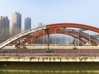 Construction workers are polishing, painting, and maintaining the Zhenxing Bridge in Donghai County, Lianyungang City, Jiangsu Province, Chi...