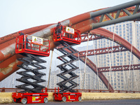 Construction workers are polishing, painting, and maintaining the Zhenxing Bridge in Donghai County, Lianyungang City, Jiangsu Province, Chi...