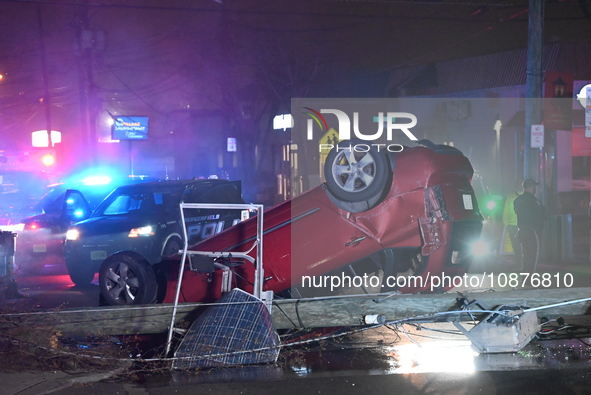 A vehicle is overturning and crashing into a pole in Bergenfield, New Jersey, United States, on December 27, 2023. The vehicle is overturnin...