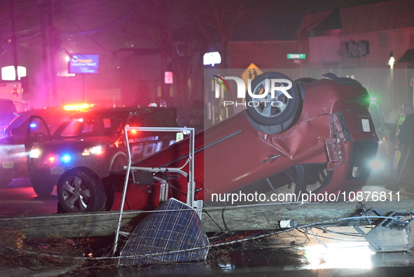 A vehicle is overturning and crashing into a pole in Bergenfield, New Jersey, United States, on December 27, 2023. The vehicle is overturnin...