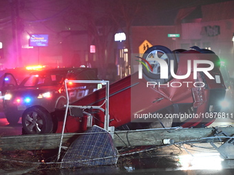 A vehicle is overturning and crashing into a pole in Bergenfield, New Jersey, United States, on December 27, 2023. The vehicle is overturnin...