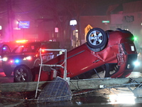 A vehicle is overturning and crashing into a pole in Bergenfield, New Jersey, United States, on December 27, 2023. The vehicle is overturnin...