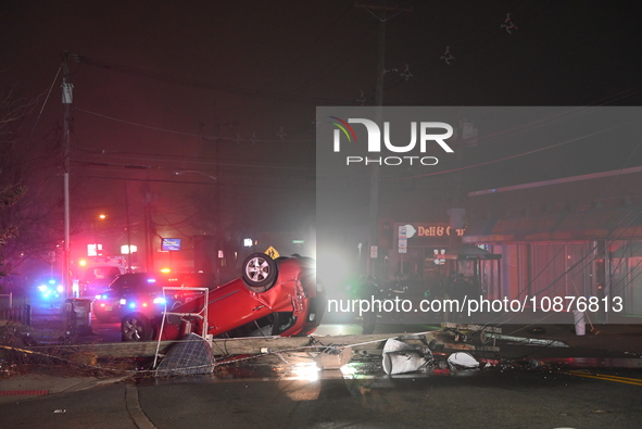 A vehicle is overturning and crashing into a pole in Bergenfield, New Jersey, United States, on December 27, 2023. The vehicle is overturnin...