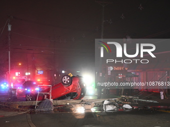 A vehicle is overturning and crashing into a pole in Bergenfield, New Jersey, United States, on December 27, 2023. The vehicle is overturnin...