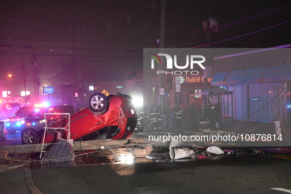 A vehicle is overturning and crashing into a pole in Bergenfield, New Jersey, United States, on December 27, 2023. The vehicle is overturnin...