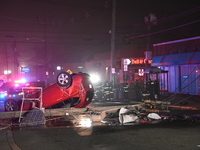 A vehicle is overturning and crashing into a pole in Bergenfield, New Jersey, United States, on December 27, 2023. The vehicle is overturnin...