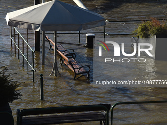 Benches are submerged on the embankment of the Danube as a wave of floods is expected on the river, in Budapest, Hungary, on December 28, 20...