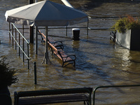 Benches are submerged on the embankment of the Danube as a wave of floods is expected on the river, in Budapest, Hungary, on December 28, 20...