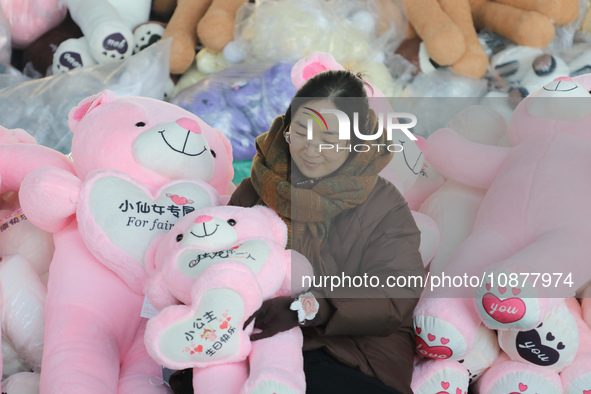 Workers are processing plush toys for export at a toy factory in Lianyungang City, East China's Jiangsu Province, on December 28, 2023. 