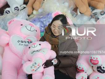 Workers are processing plush toys for export at a toy factory in Lianyungang City, East China's Jiangsu Province, on December 28, 2023. (