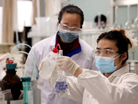 Two graduate students are researching and developing chemical products in a laboratory of a private chemical enterprise in Xiwangzhuang Town...