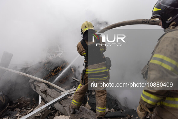 Firefighters are tackling blazes and people are taking shelter in Kharkiv after a massive Russian attack on areas across Ukraine, on Decembe...