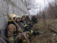 Firefighters are tackling blazes and people are taking shelter in Kharkiv after a massive Russian attack on areas across Ukraine, on Decembe...