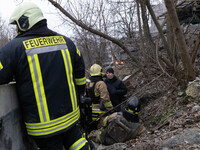 Firefighters are tackling blazes and people are taking shelter in Kharkiv after a massive Russian attack on areas across Ukraine, on Decembe...