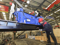 A worker is assembling a generator at a manufacturing enterprise in Qingzhou, East China's Shandong province, on December 31, 2023. (