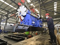 A worker is assembling a generator at a manufacturing enterprise in Qingzhou, East China's Shandong province, on December 31, 2023. (